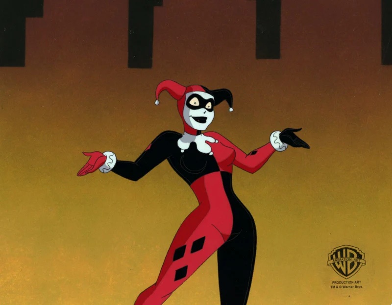 Harley Quinn in Batman: the Animated Series, where she appears in her original character design: she wears a two-pronged jester hat, with one red side and one black side. She is wearing a black mask over her eyes and white face paint. She is wearing a checker-patterned red and black unitard, with black diamonds on her leg, and red and black gloves.